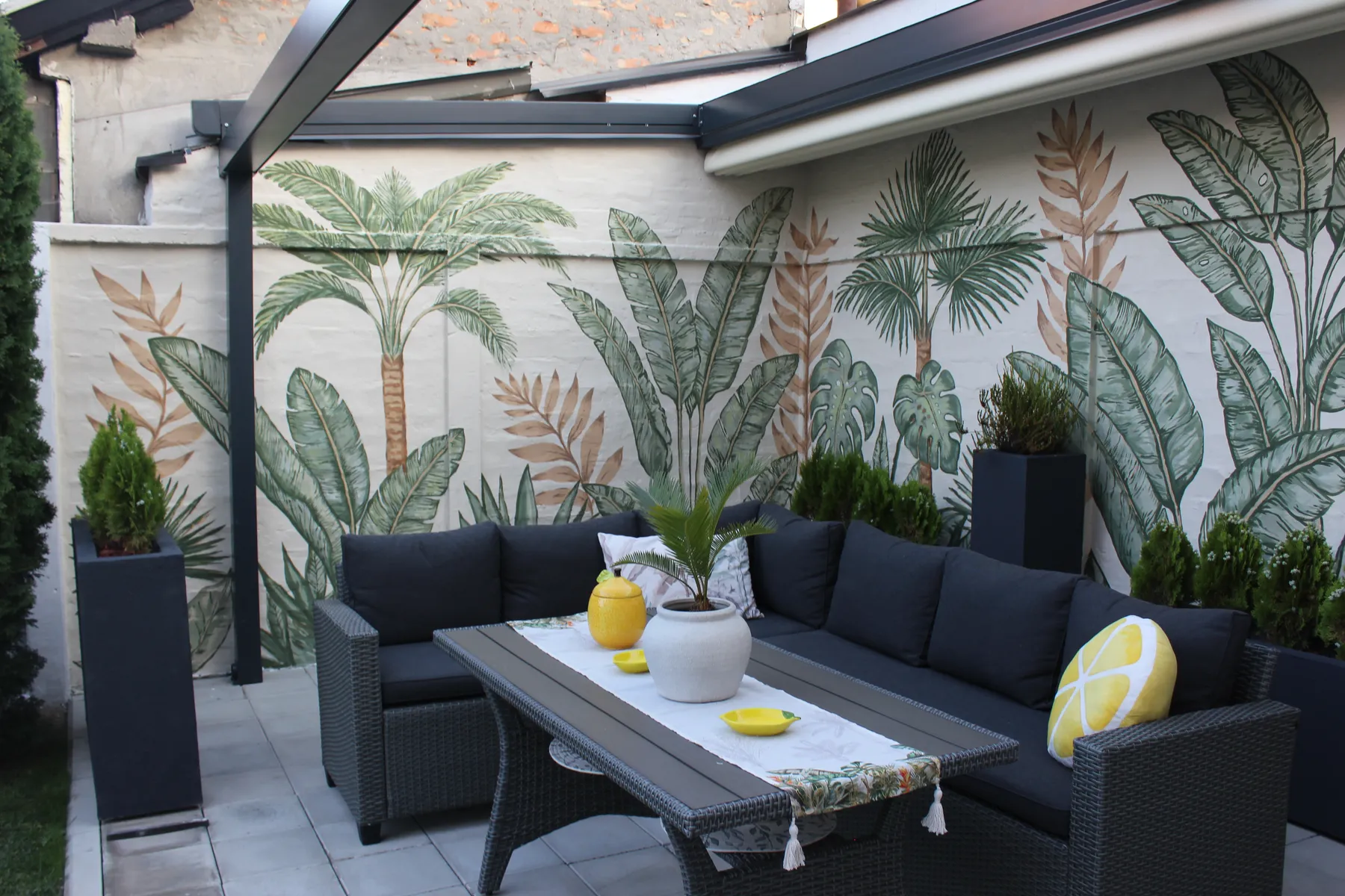 Botanical palm mural on a home's backyard wall